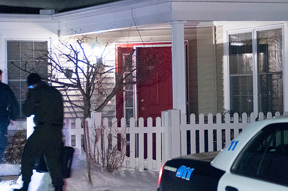 Investigators enter the house at 49 Kensington Lane