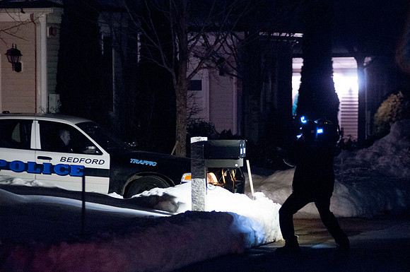 Bedford Police Officer secures scene at 49 Kennsington Lane Bedford