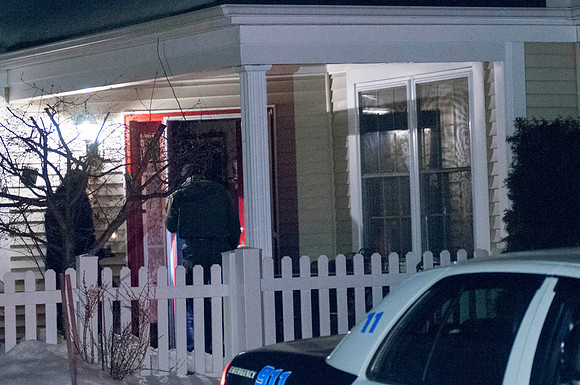 Investigators enter the house at 49 Kensington Lane
