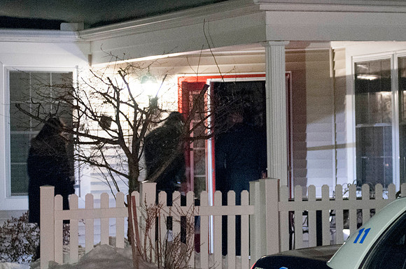 Investigators enter the house at 49 Kensington Lane